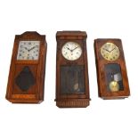 Three early 20th Century oak-cased wall clocks