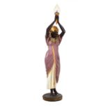 Large moulded figural torchere modelled as an Egyptian lady