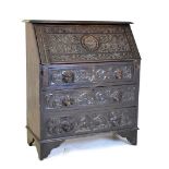 Carved oak bureau