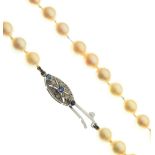 Uniform row of cultured pearls