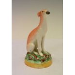 Victorian Staffordshire pottery model of a seated greyhound