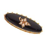 Victorian black onyx gold mounted brooch