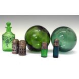 Assorted green glass scent bottles and two buoys