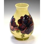 Moorcroft - Anemone pattern baluster vase on a cream ground