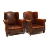 Pair of 1920s leather club armchairs