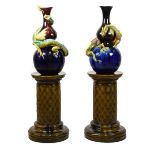 Pair of Burmantofts dragon double gourd vases on pedestal bases