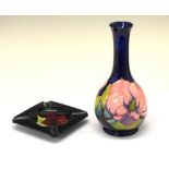 Moorcroft pottery-'Magnolia' pattern baluster vase together with a 'Hibiscus' pattern ashtray