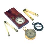 Pocket barometer, together with an ivory ruler, wooden case compass etc