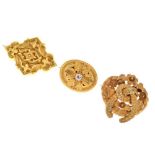 Victorian yellow metal brooch, and two gilt metal brooches