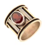 White metal ring set an oval faceted garnet