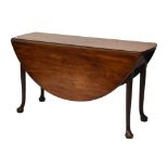 George III mahogany pad foot oval drop-leaf dining table