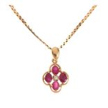 9ct gold, ruby and diamond quatrefoil pendant on a 9ct chain