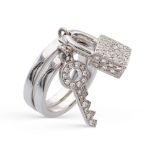 Two 18kt white gold and diamond rings with charms weight 13 gr.