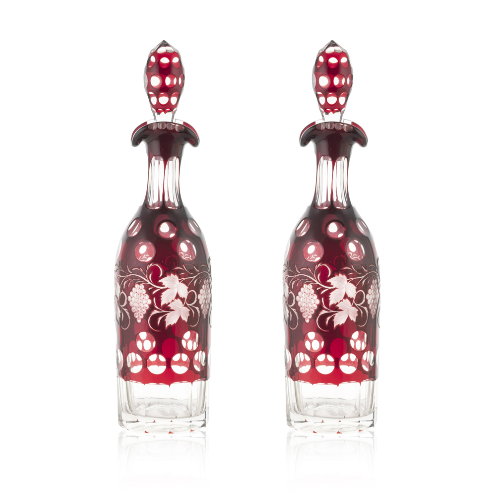Pair of transparent and colored glass bottles