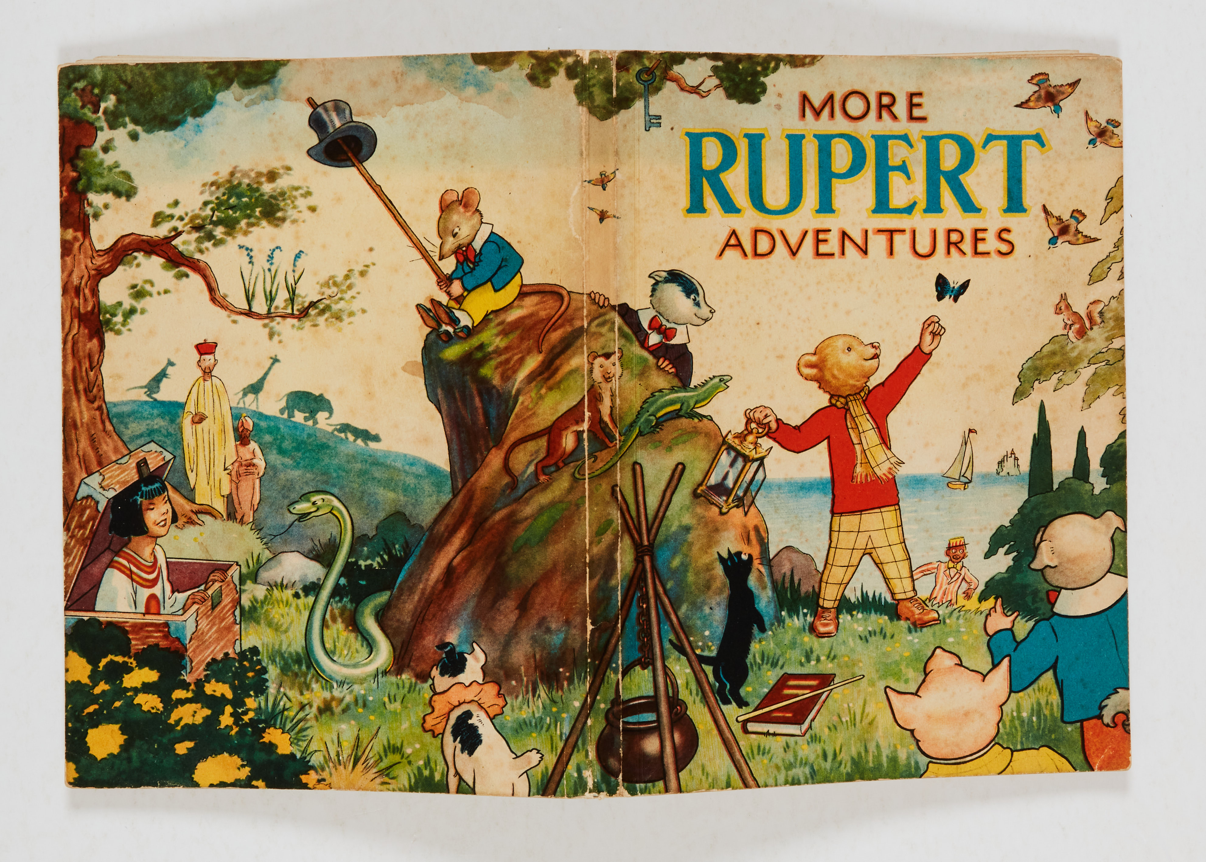 More Rupert Adventures (1943). Light foxing and crease to front cover, pen dedication, clean white