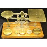 VICTORIAN POSTAL SCALES - 19th c. brass postal scale on rectangular hardwood base with five brass