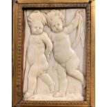 Early Carved Bone Plaque of Putti Figures