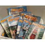 Box of vintage Meccano magazines.