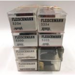 2 Fleischmann coaches and 2 others together with 4 Fleischmann wagons. All in Perspex cases.