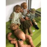 Collection of vintage dolls in various conditions.