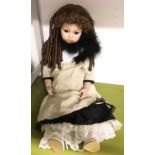 Bru Jne 13 bisque doll with brown eyes and hair.