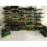 Collection of 35 Hachette Tractors diecast models in bubble packs.