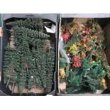 Two trays of OO model railway scenic trees and bushes.