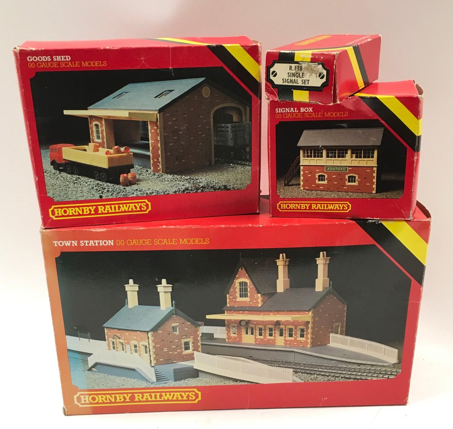 Hornby R593 Town station, R506 Goods Shed, R503 Signal Box and R138 Single Signal set. All boxed.