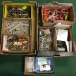 Two trays of OO model railway accessories to include large quantity of wire, signal gantries,