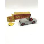 Dinky 105 Triumph TR2 Sports Car - grey, red interior and ridged hubs with black smooth tyres,