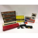 Box containing various OO gauge boxed and unboxed coaches and wagons to include 3 x Mainline (see