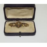 A Victorian 0.15pt Diamond 15ct gold brooch.