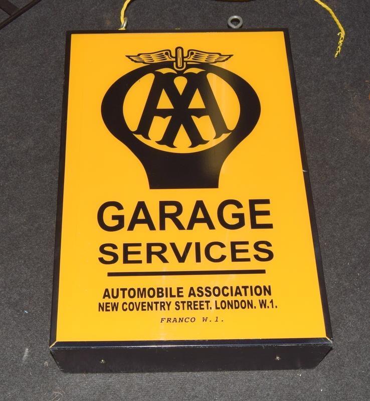 A double-sided AA garage advertising sign