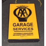 A double-sided AA garage advertising sign