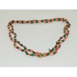 A Vintage carved Coral/Malachite 9ct gold necklace.