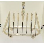 Silver plate toast rack in the form of cricket bats