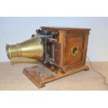 An early magic lantern slide projector converted to electricity for the brass conical lens