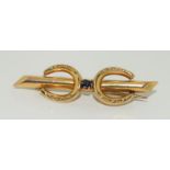 A Victorian Sapphire 9ct gold Horseshoe brooch.