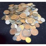 Collection of coins in a plastic tub