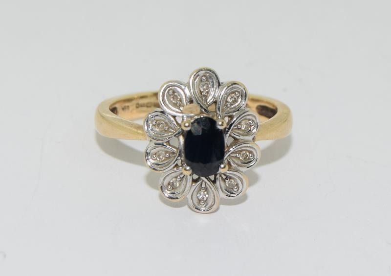 9 carat gold diamond and Sapphire flower ring size N