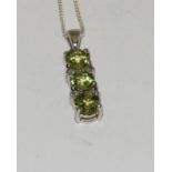 Three stone Peridot 925 silver line pendant.