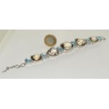 Large silver and smokey quarts with blue topaz bracelet