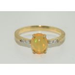 Indonesian fire opal and diamond 9ct gold dress ring. Size N.