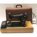 A singer 99 model electric sewing machine in its case