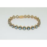 9ct gold ladies sapphire set tennis bracelet 19cm long, 23g