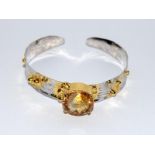 Gold and silver citrine bangle.