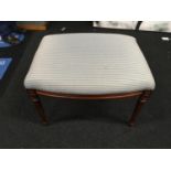 A modern mahogany upholstered footstool.48x69x50cm