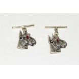 Pair silver cuff links in the form of dogs