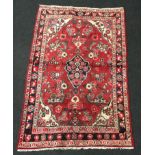 Hamdan rug in medallion blue, red and cream.202x124