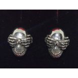 Pair of silver skull earrings